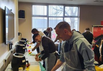 Men at a cooking session