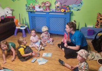 Reading to a group of children
