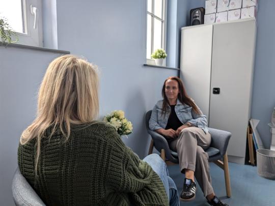 A counselling session with two women