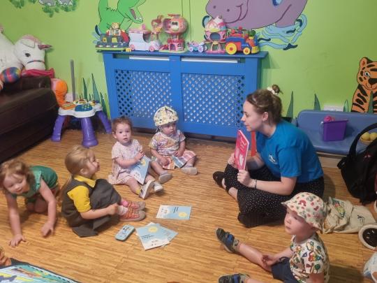 Reading to a group of children